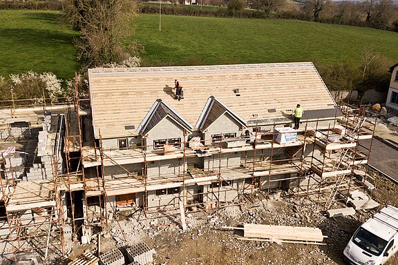 aerial-photo-of-brown-3-story-house-2098624.jpg  